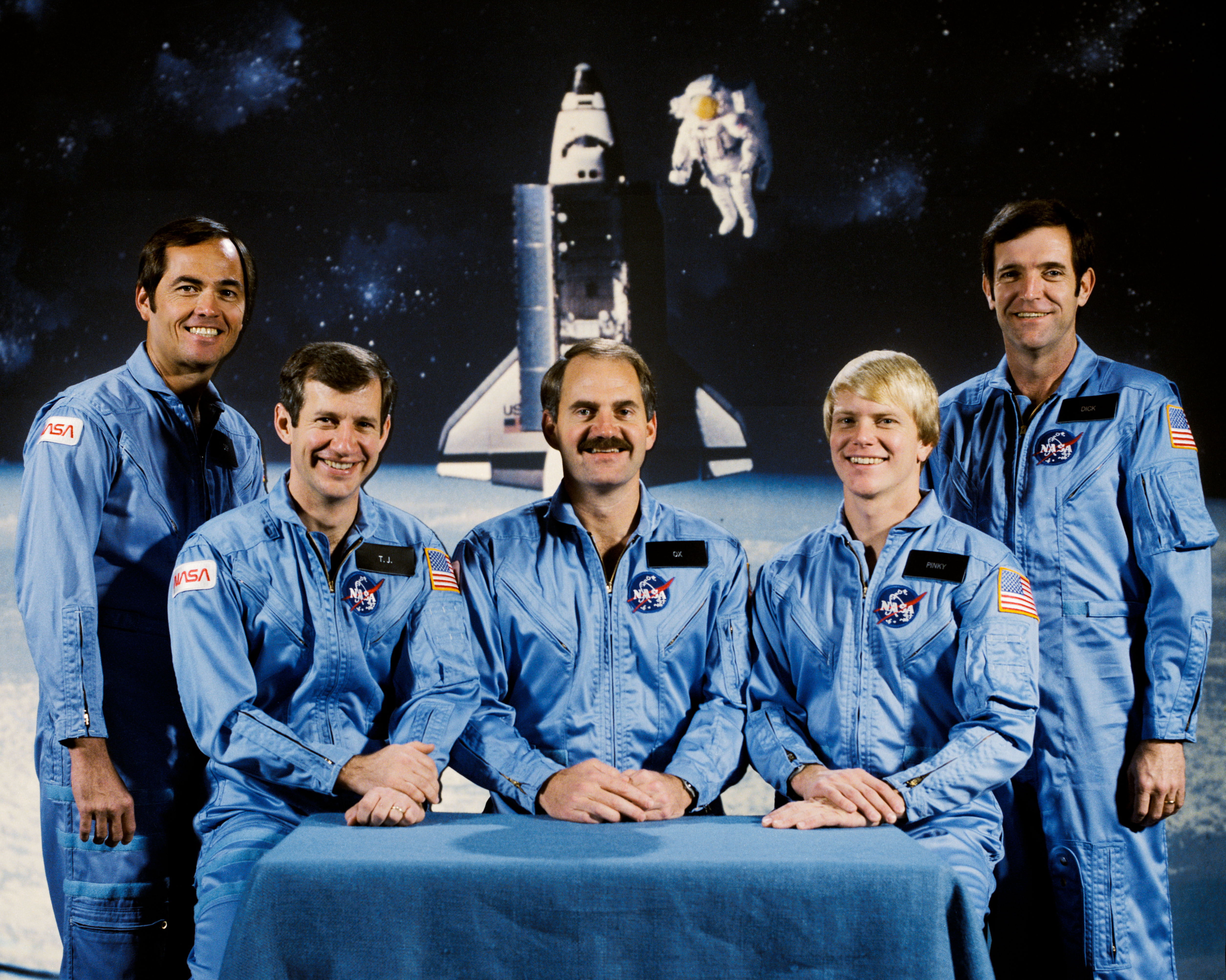 The STS-41C crew of (clockwise from bottom left) Commander Robert L. Crippen, Mission Specialists Terry J. Hart, James D. “Ox” Van Hoften, and George D. “Pinky” Nelson, and Pilot Francis R. “Dick” Scobee