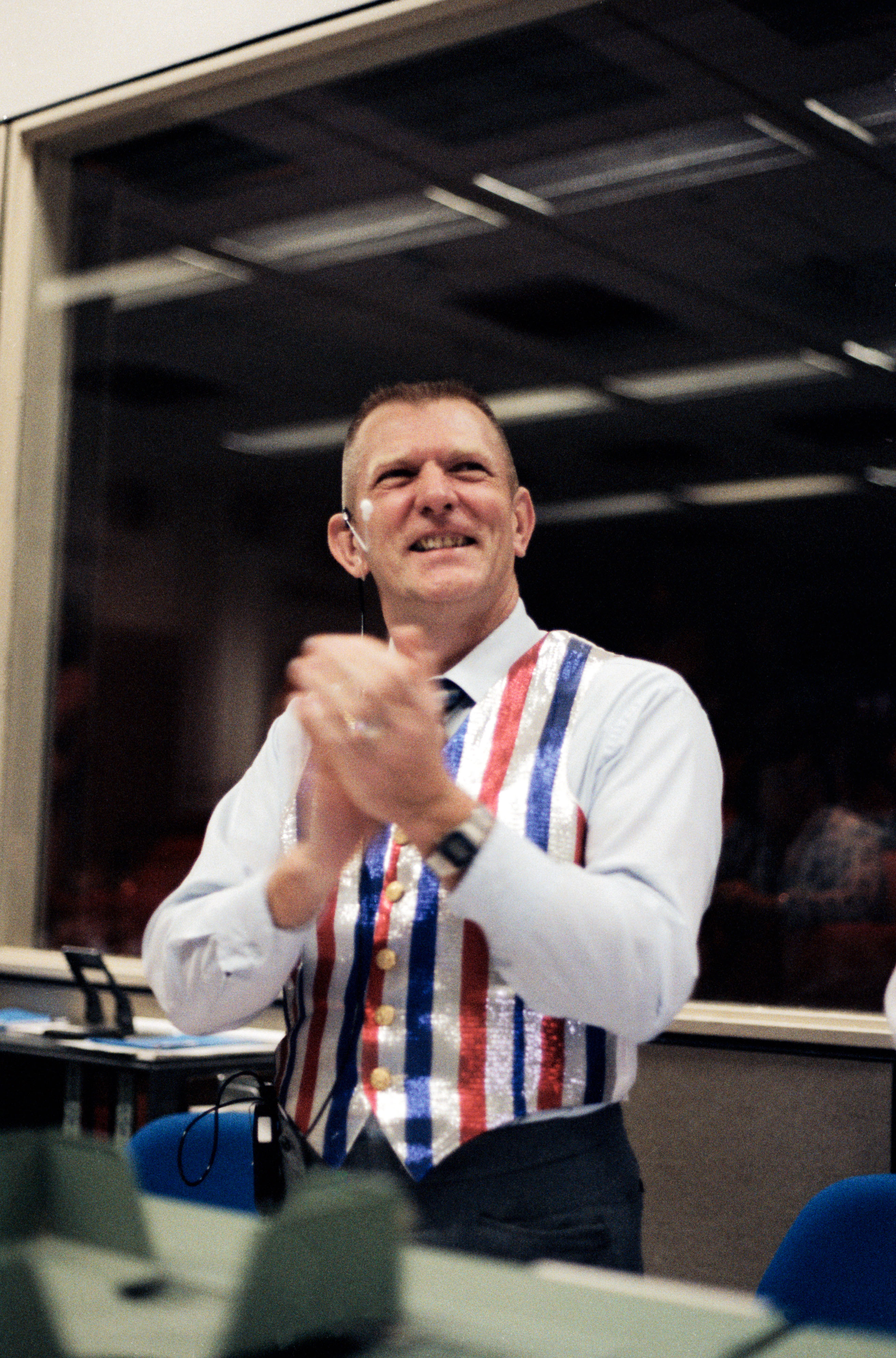In Mission Control at NASA’s Johnson Space Center in Houston, Lead STS-41C Flight Director Eugene F. Kranz applauds the successful landing of STS-41C