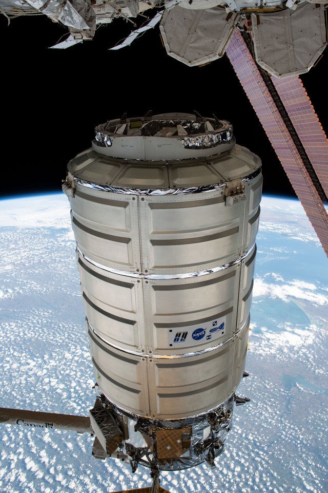iss060e022965 (Aug. 6, 2019) --- The Cygnus space freighter from Northrop Grumman is in the grips of the Canadarm2 robotic arm following its detachment from the Unity module where it was installed for 109 days of cargo transfer operations.