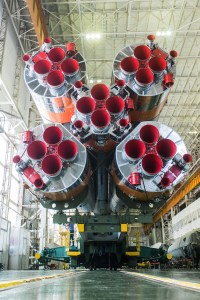 jsc2019e039432 (July 16, 2019) --- In the Integration Building at the Baikonur Cosmodrome in Kazakhstan, the first stage engines of the Soyuz booster are prominent in the field of view July 16 as final preparations begin for the launch of three new crewmembers to the International Space Station. Drew Morgan of NASA, Alexander Skvortsov of Roscosmos and Luca Parmitano of the European Space Agency will launch July 20 on the Soyuz MS-13 spacecraft from the Baikonur Cosmodrome for a mission on the International Space Station. Credit: Andrey Shelepin/GCTC