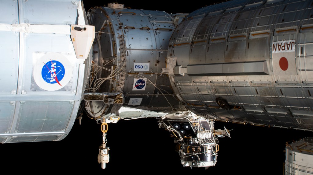 iss060e007002 (July 12, 2019) --- The forward-end of the International Space Station is pictured highlighting portions of three modules and a pressurized mating adapter. An external high definition camera captured (from left) the Permanent Multipurpose Module (PMM), the Harmony Module and the Japanese Kibo laboratory module. Protruding from the Harmony module is the pressurized mating adapter that will host the International Docking Adapter-3. The PMM is actually in front of the U.S. Destiny laboratory module to which Harmony is attached to.