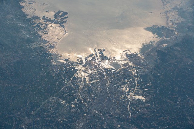 iss060e052554 (Sept. 2, 2019) --- The northeastern Chinese port city of Tianjin is pictured with the Sun's glint beaming off the Bohai Sea as the International Space Station orbited 263 miles above the Asian continent.