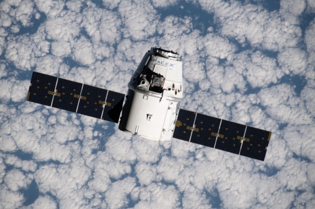 iss060e015838 (July 27, 2019) --- The SpaceX Dragon space freighter approaches the International Space Station as both spacecraft were orbiting 265 miles above the Atlantic Ocean off the west coast of Namibia.