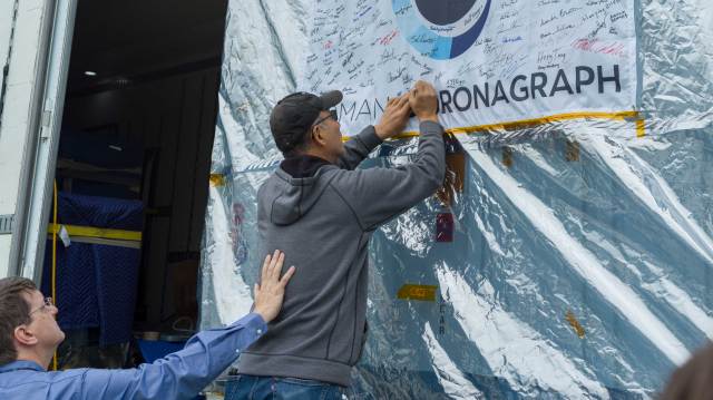 Team members at JPL said farewell to the Roman Coronagraph Instrument on May 17 by signing their names to a flag (featuring the mission logo) on the outside of the shipping container that carried the instrument to NASA’s Goddard Space Flight Center.
