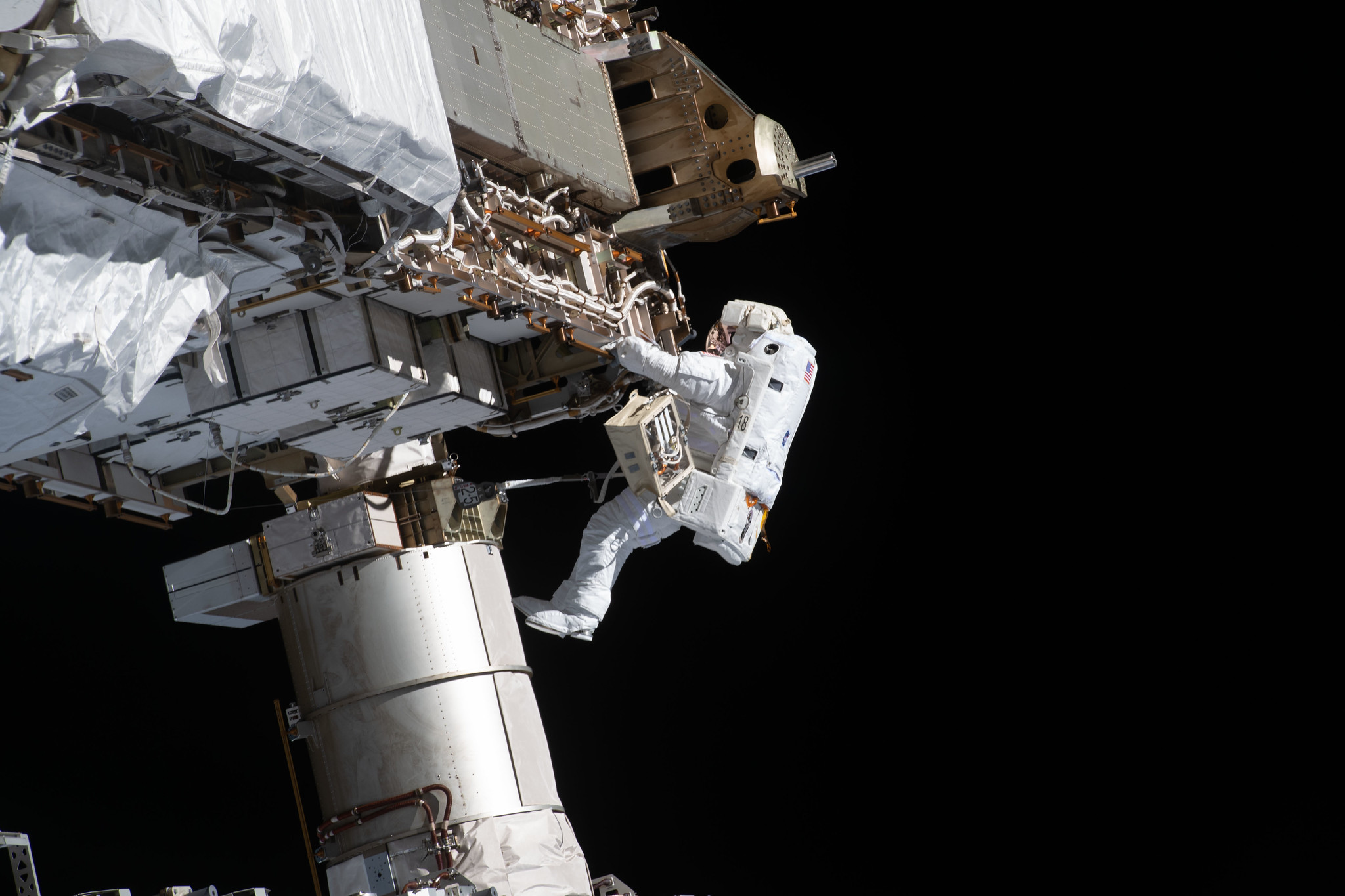 NASA spacewalker and Expedition 64 Flight Engineer Victor Glover works to ready the International Space Station's port-side truss structure for future solar array upgrades.