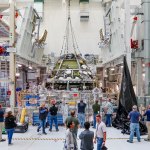Engineers connect the Orion crew and service modules for the Artemis II mission on Oct. 19, 2023, inside the Neil Armstrong Operations and Checkout Building at NASA’s Kennedy Space Center in Florida.