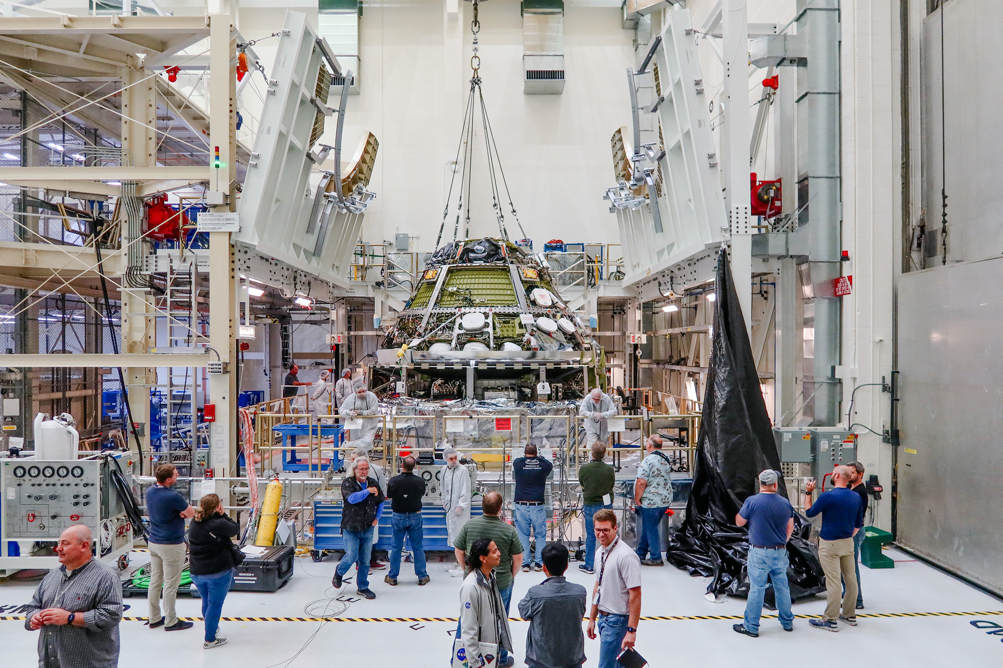 Engineers connect the Orion crew and service modules for the Artemis II mission on Oct. 19, 2023, inside the Neil Armstrong Operations and Checkout Building at NASA’s Kennedy Space Center in Florida.