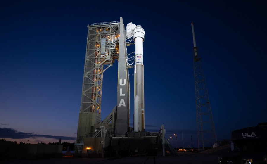A United Launch Alliance Atlas V rocket with Boeing’s CST-100 Starliner spacecraft aboard is seen illuminated by spotlights at sunset on the launch pad at Space Launch Complex 41 ahead of the NASA’s Boeing Crew Flight Test. Credit: NASA/Joel Kowsky