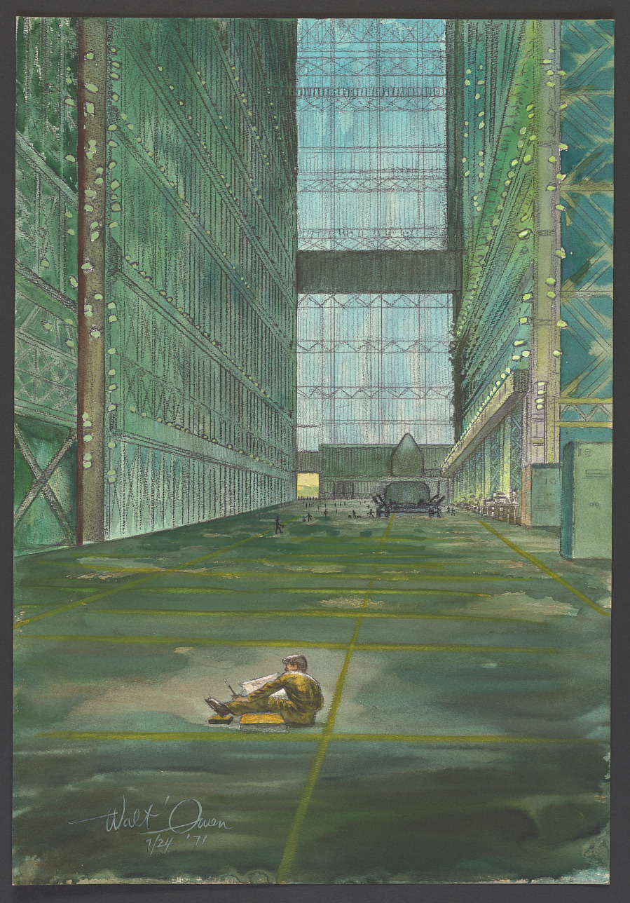 An artist is seated on the ground inside the Vehicle Assembly Building (VAB). The building is empty until the near the back by the large glass window where some figures seem to be working on a large object. The scene is predominantly green and the artist is in shades of yellow and brown.