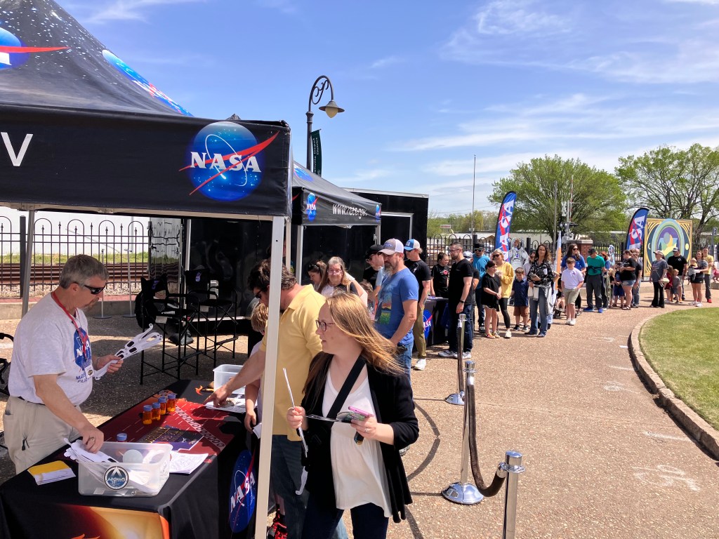 image is a view of the attendees in line to obtain solar eclipse glasses