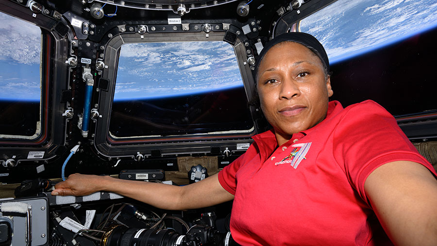NASA astronaut Jeanette Epps poses for a portrait inside the seven-window cupola while orbiting 259 miles above Greece.