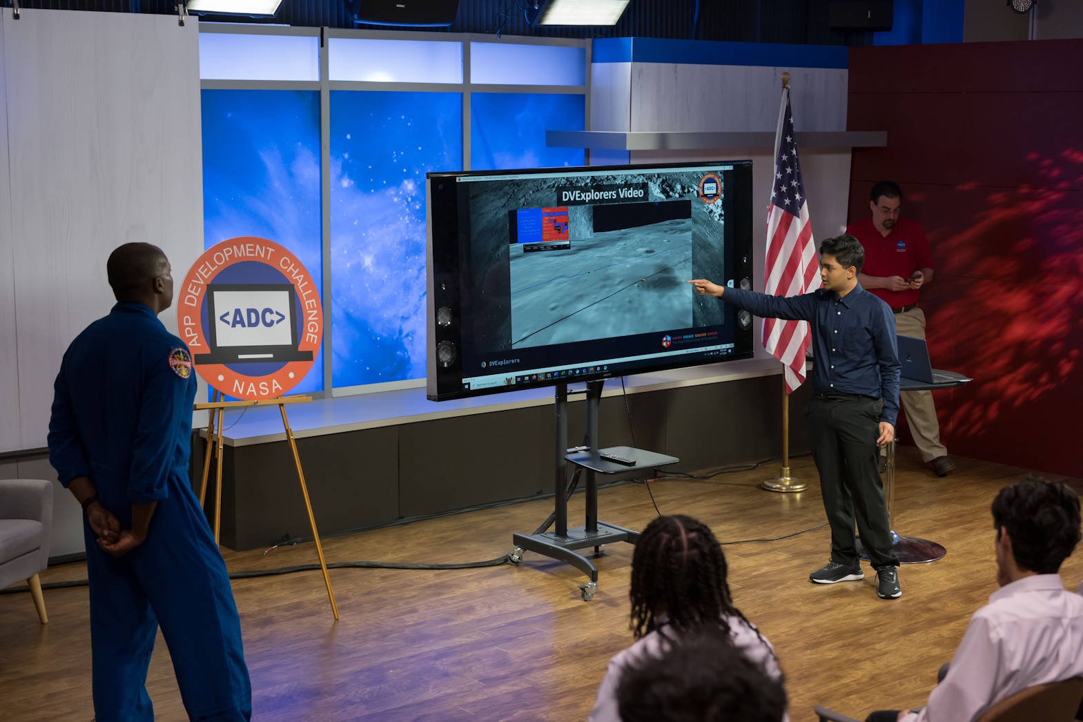 NASA Astronaut Andre Douglas reviews DV Explorers’, a 2024 App Development Challenge top team from Baton Rouge Magnet School in Baton Rouge, Louisiana, application for traversing the lunar surface. 
