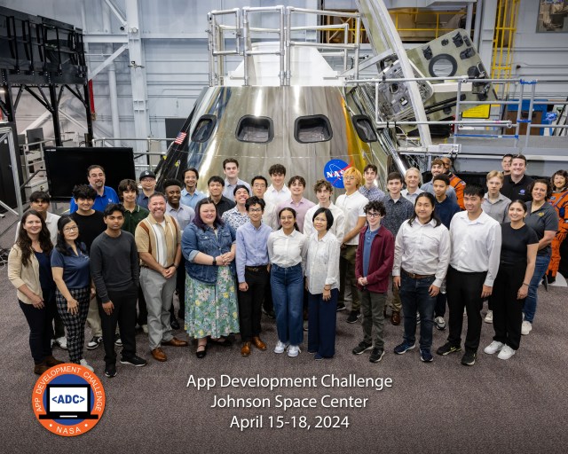 The 2024 App Development Challenge top teams in front of the Orion Capsule in the Space Vehicle Mockup Facility at NASA’s Johnson Space Center in Houston.