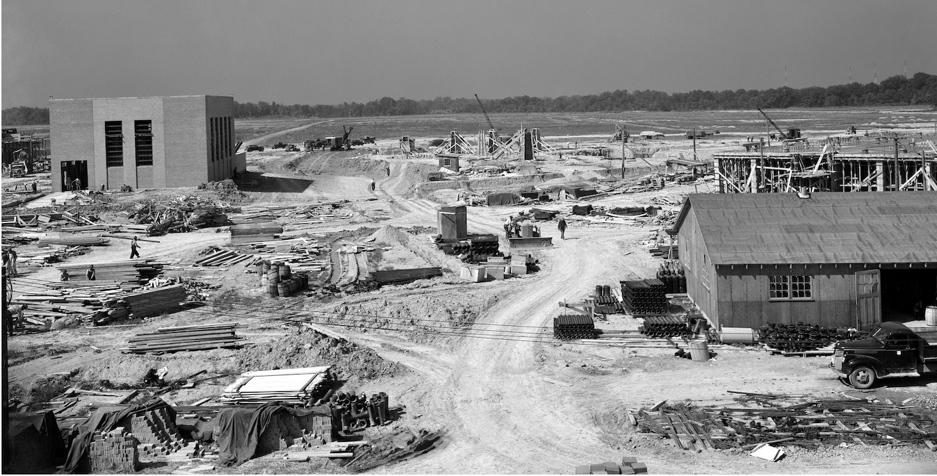 View of construction at the Aircraft Engine Research Laboratory (now, NASA’s Glenn Research Center) in 1942. Building supplies are scattered across the dirt-covered landscape and several buildings can be seen under construction.