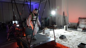 A test subject is pictured simulating a Martian EVA using virtual reality (VR) as part of the PersEIDS test. H-3PO uses this test to gather bioinformatic information such as heartrate and oxygenation levels while the user performs space walks on a simulated Martian surface. The user is walking on 360-degree treadmill while wearing a VR headset for full immersion. Credit: NASA
