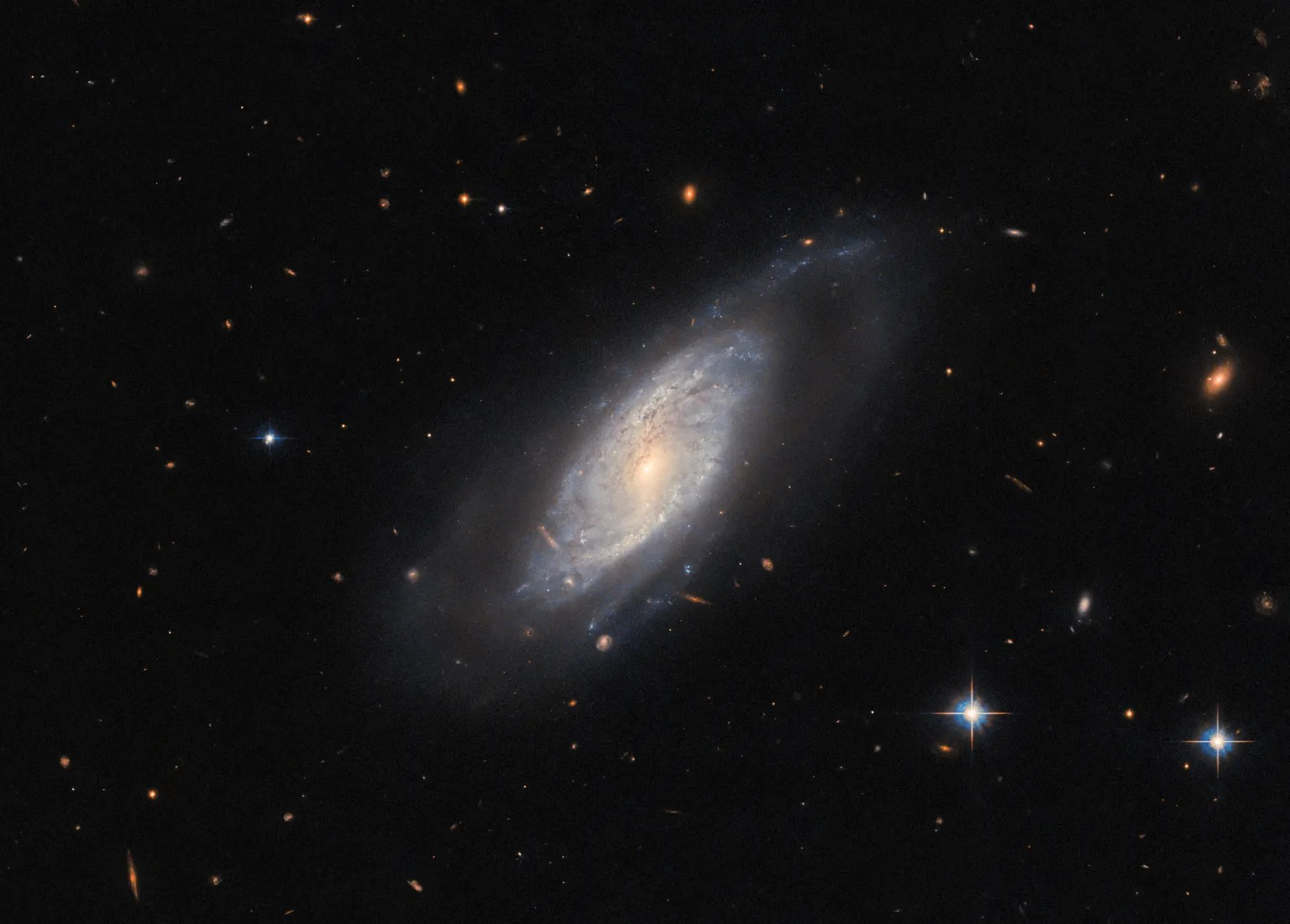 This image from the NASA/ESA Hubble Space Telescope highlights the spiral galaxy UGC 9684.