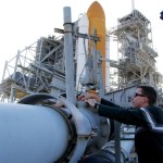 Kennedy Space Center's Dr. Luke Roberson applies hydrogen detection tape on a connector joint on a cross-country feed line.