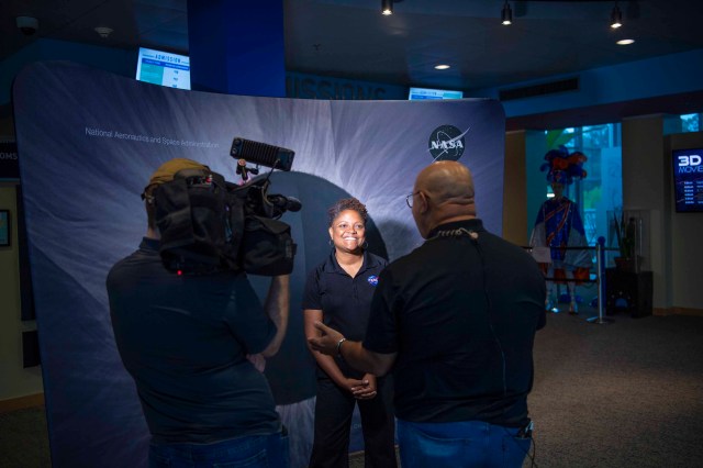 Dr. Kamili Shaw interviews with WAPT reporter Troy Johnson at INFINITY Science Center