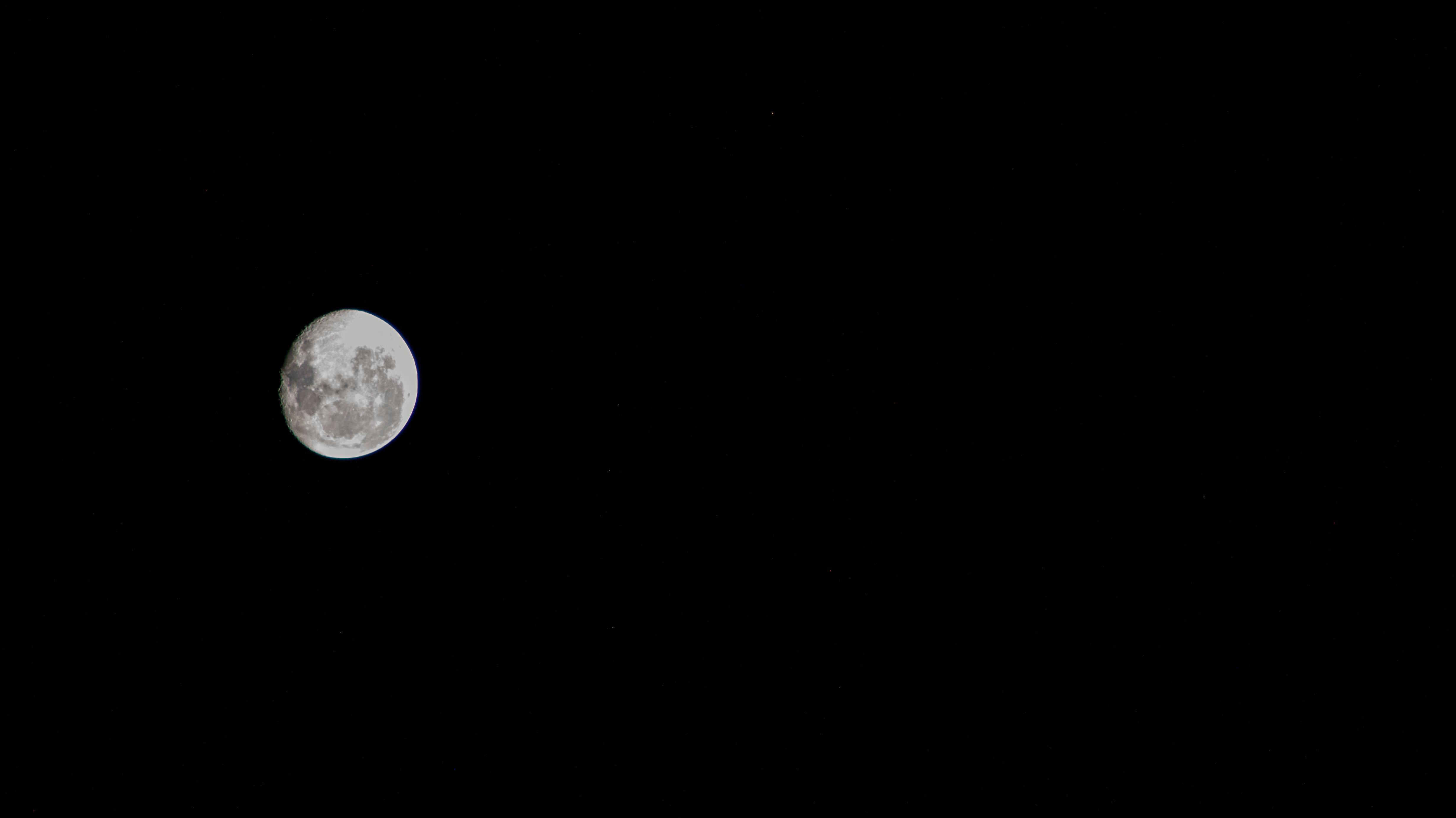 iss071e045749 (April 26, 2024) -- An illuminated waning gibbous moon contrasts the deep black of space as the International Space Station soared 270 miles over the Southern Ocean.