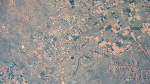 Amarillo, Texas, near Palo Duro Canyon State Park (bottom right), is home to Rick Husband Amarillo International Airport (center top), named after the former NASA astronaut. The International Space Station was orbiting 258 miles above the Lone Star State's Panhandle as the time of this photgraph.