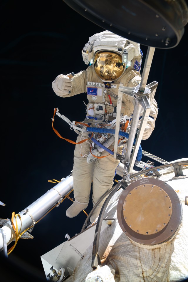 Cosmonaut Nikolai Chub is pictured outside of the International Space Station wearing his Orlan spacesuit during a four-hour and 36-minute spacewalk. He worked on the Russian segment of the complex completing the deployment of one panel on a synthetic radar communications system. He also installed equipment and experiments to analyze the level of corrosion on station surfaces and modules.