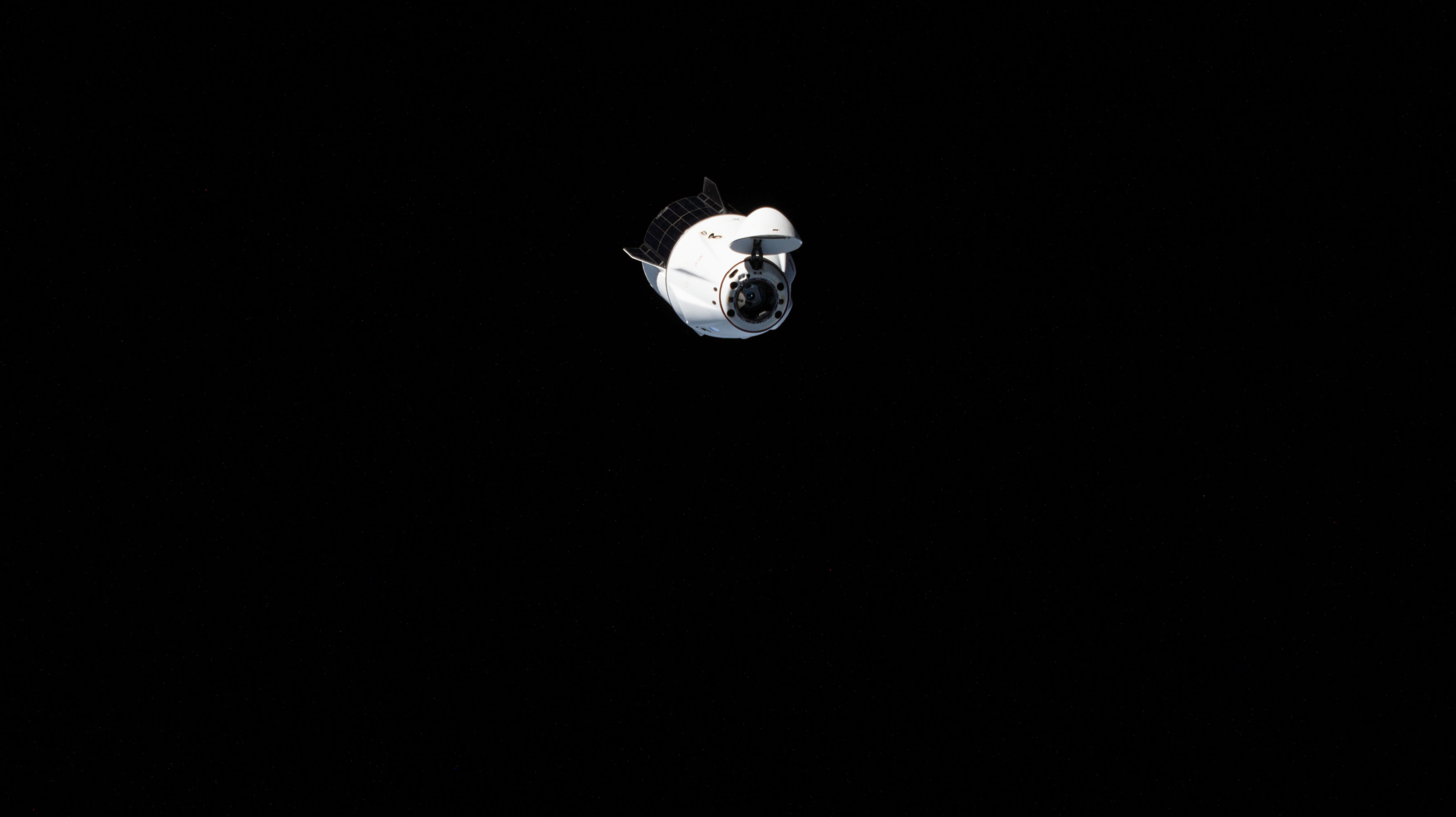 The SpaceX Dragon Endeavour spacecraft, carrying NASA astronauts Matthew Dominick, Michael Barratt, and Jeanette Epps, as well as Roscosmos cosmonaut Alexander Grebenkin, is pictured after undocking from the Harmony module's forward port on the International Space Station. Shortly afterward, Endeavour relocated to the Harmony's space-facing port opening up the forward port for Boeing's Crew Flight Test and its Starliner spacecraft carrying NASA astronauts Butch Wilmore and Suni Williams.