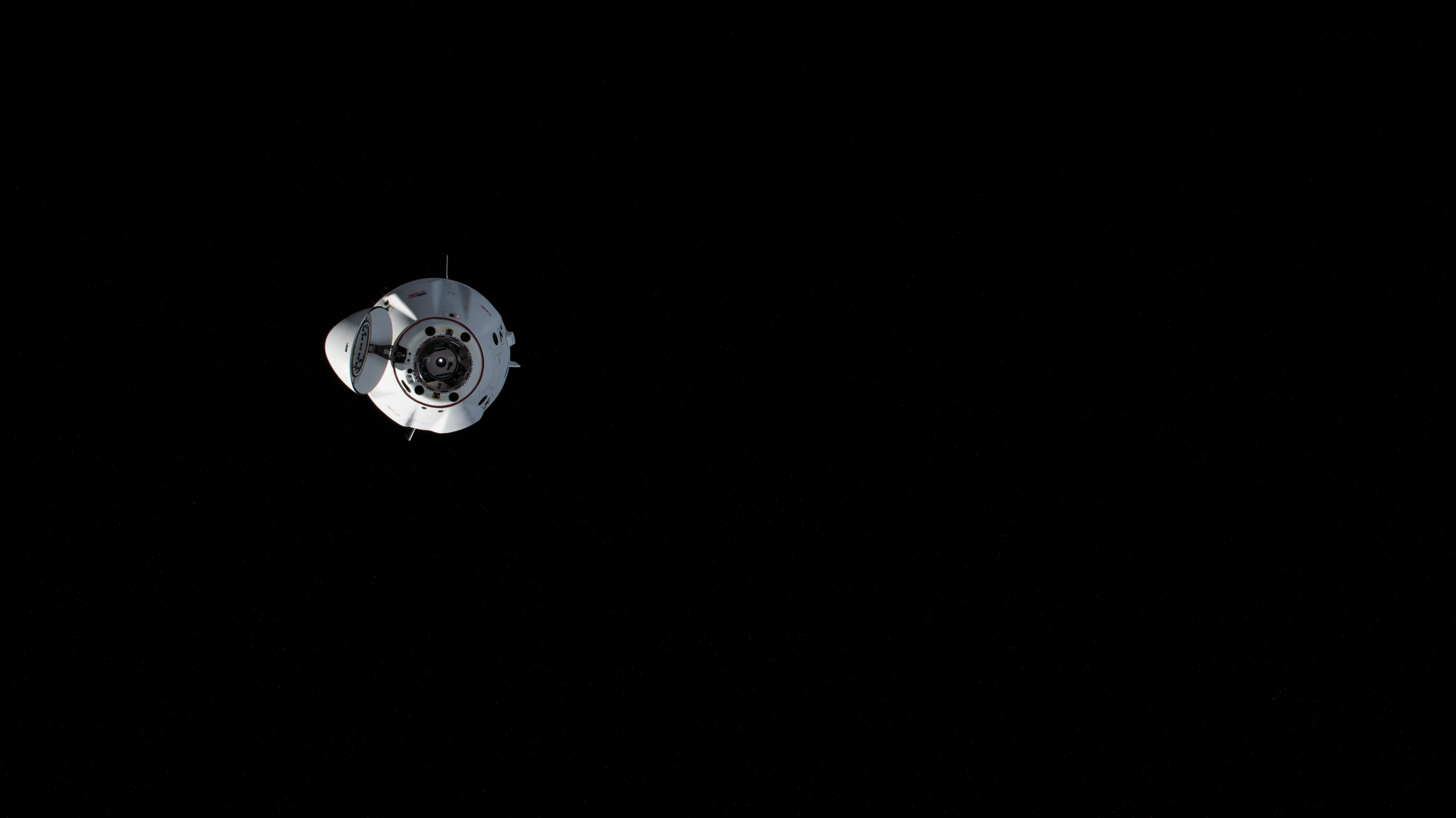 The SpaceX Dragon Endeavour spacecraft, carrying NASA astronauts Matthew Dominick, Michael Barratt, and Jeanette Epps, as well as Roscosmos cosmonaut Alexander Grebenkin, is pictured after undocking from the Harmony module's forward port on the International Space Station. Shortly afterward, Endeavour relocated to the Harmony's space-facing port opening up the forward port for Boeing's Crew Flight Test and its Starliner spacecraft carrying NASA astronauts Butch Wilmore and Suni Williams.
