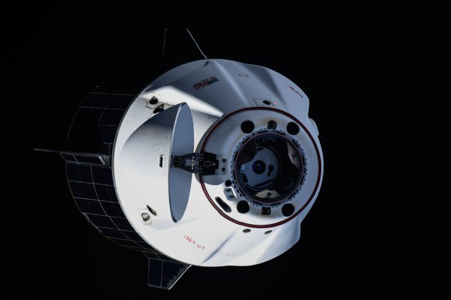iss071e052057 (May 2, 2024) --- The SpaceX Dragon Endeavour spacecraft backs away from the International Space Station. Dragon switched ports moving from the Harmony module's forward port to its space-facing port during the relocation maneuver.