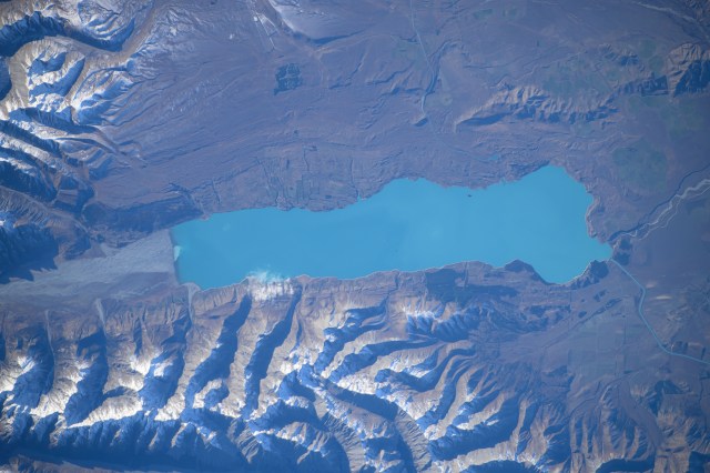 Lake Pukaki, fed by the Tasman River and south of Aoraki/Mount Cook in the Southern Alps, is pictured from the International Space Station as it orbited 266 miles above New Zealand.