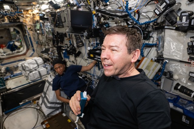 Expedition 71 Flight Engineers (from left) Jeanette Epps and Mike Barratt, both NASA astronauts, are pictured during a video crew conference aboard the International Space Station's Destiny laboratory module.