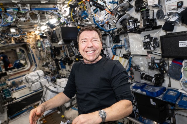 Expedition 71 Flight Engineer and NASA astronaut Mike Barratt smiles for a portrait aboard the International Space Station's Destiny laboratory module.