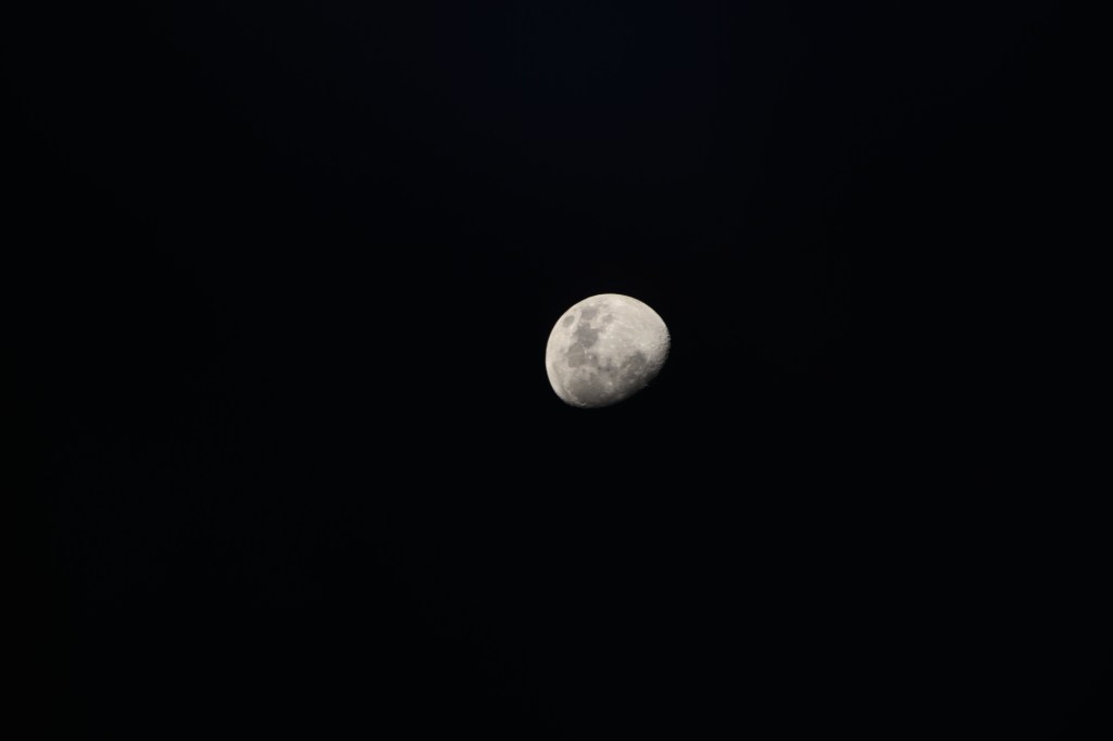 iss071e092177 (May 19, 2024) -- An illuminated waxing gibbous moon is pictured from the International Space Station as it soared 258 miles above the Indian Ocean.