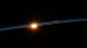 The first rays of an orbital sunrise penetrate Earth's atmosphere revealing the cloud tops as the International Space Station soared 262 miles above the Indian Ocean off the southeast coast of South Africa.