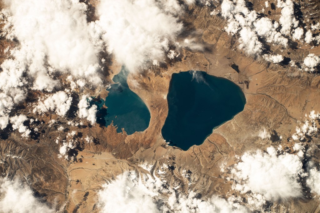 iss071e111824 (May 23, 2024) -- As the International Space Station orbited 257 miles above Tibet, Lake Manasarovar (right) and Lake Rakshastal (left) were photographed. Fed by the Kailash Glaciers, Manasarovar is a high-altitude freshwater lake, connected to its neighboring saltwater lake by the Ganga Chhu river.