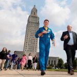 NASA astronaut Josh Cassada and NASA Marshall Space Flight Center Director Joseph Pelfrey lead students from area schools across the Louisiana State Capitol grounds to attend a series of panel discussions as part of Louisiana Space Day 2024.