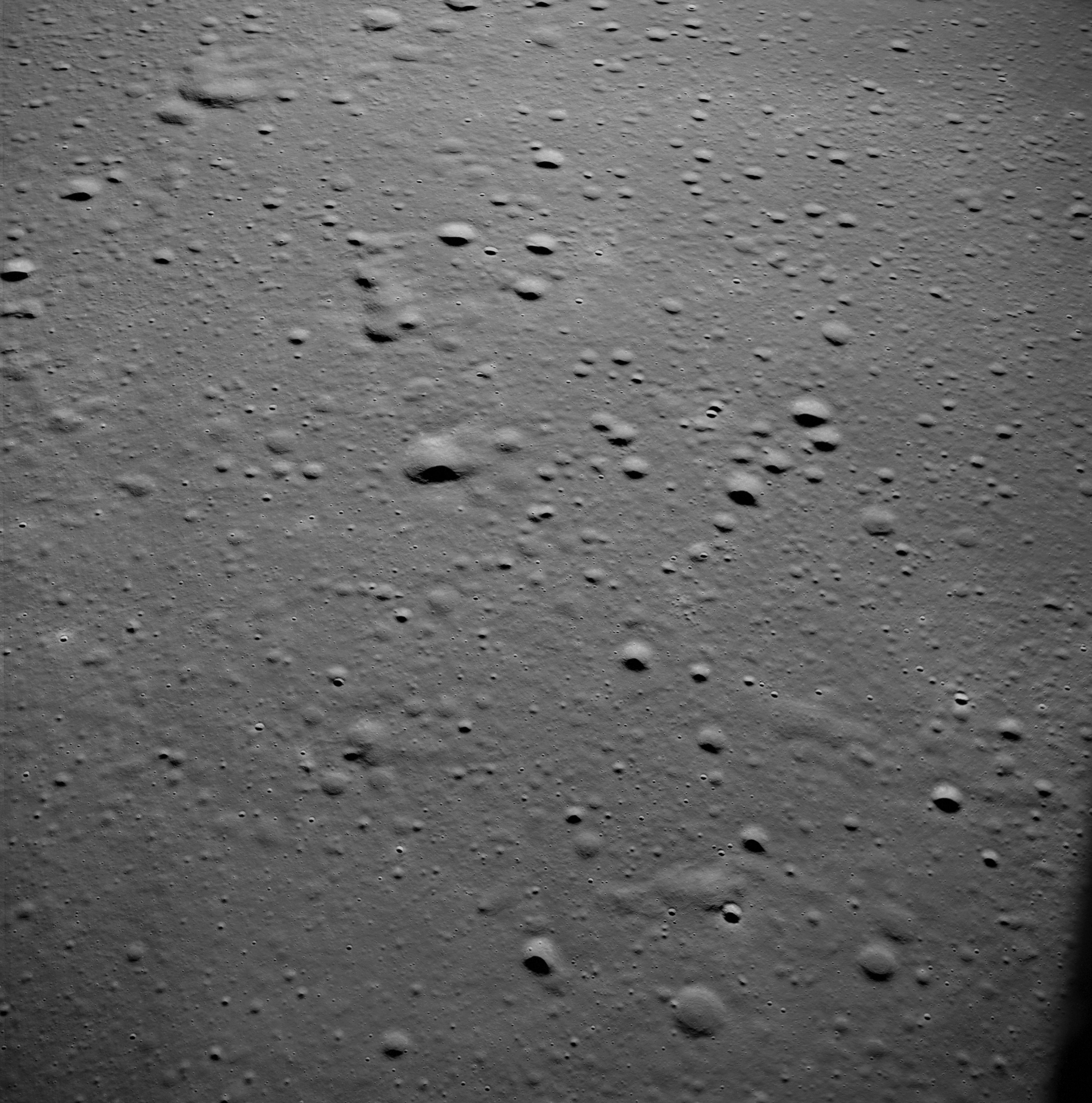 View of the Apollo 11 landing site in the Sea of Tranquility taken from the Lunar Module Snoopy during its close approach to the surface