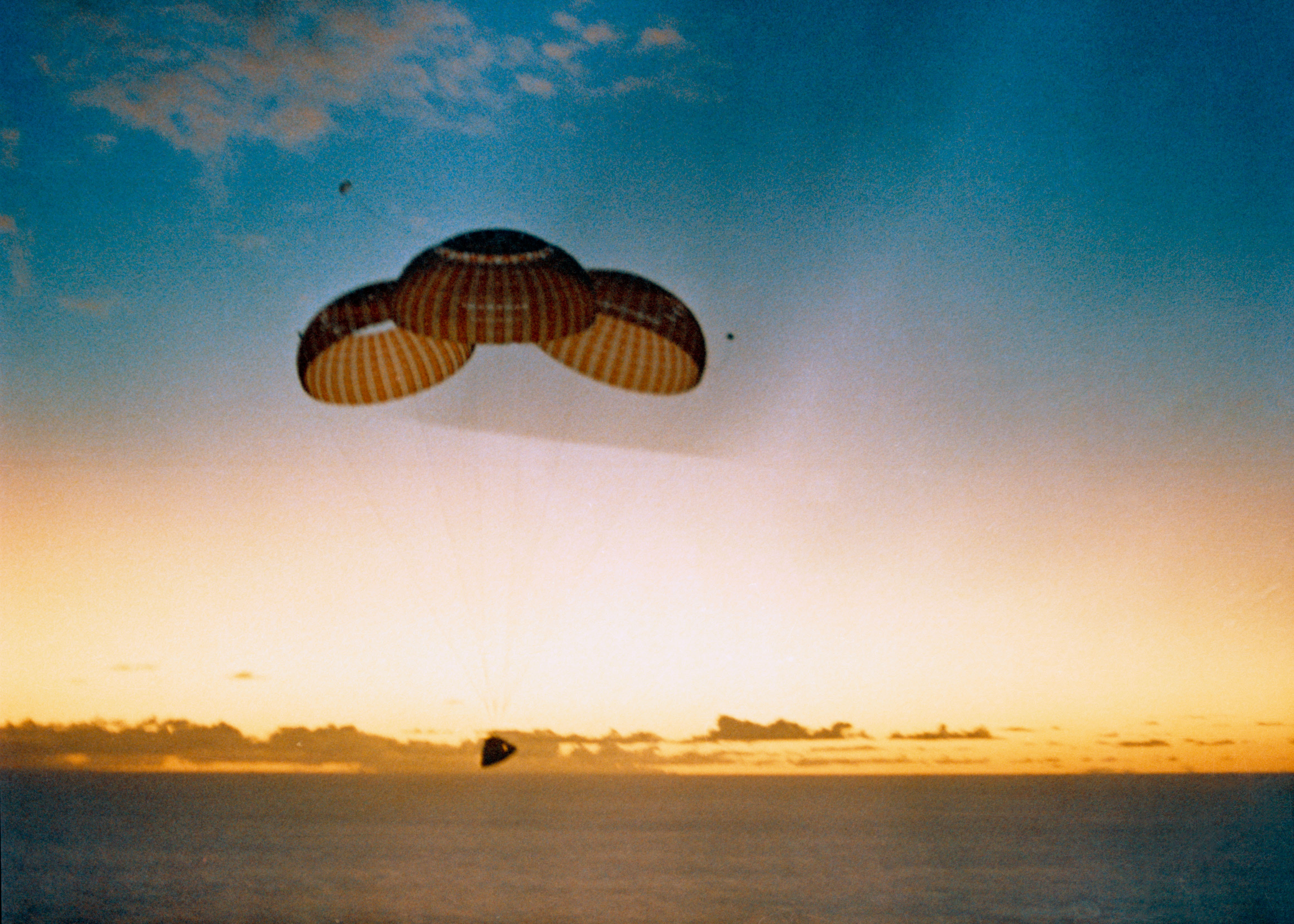 Apollo 10 on its three main parachutes shortly before splashdown