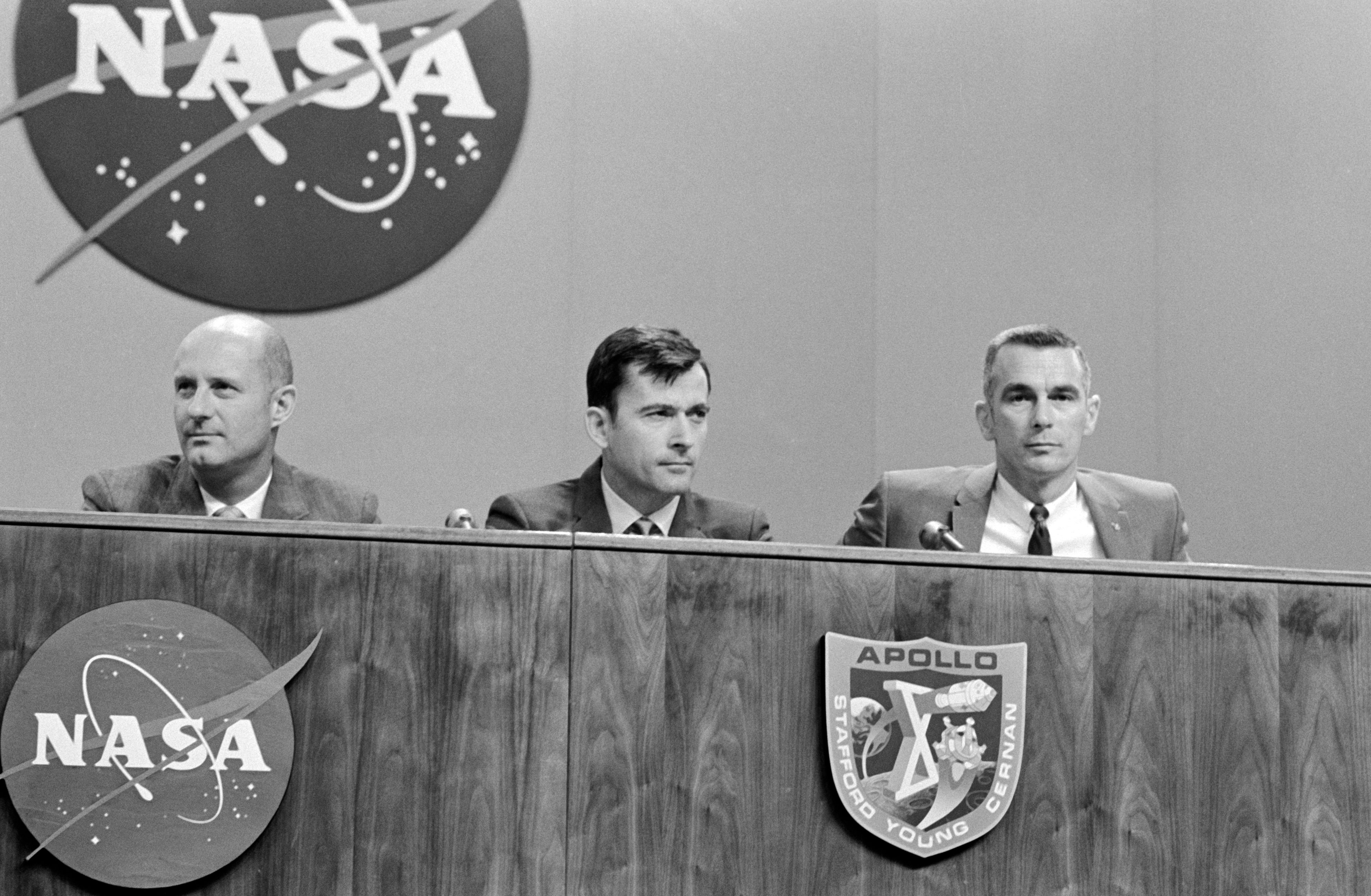Stafford, left, Young, and Cernan brief reporters during their postflight press conference