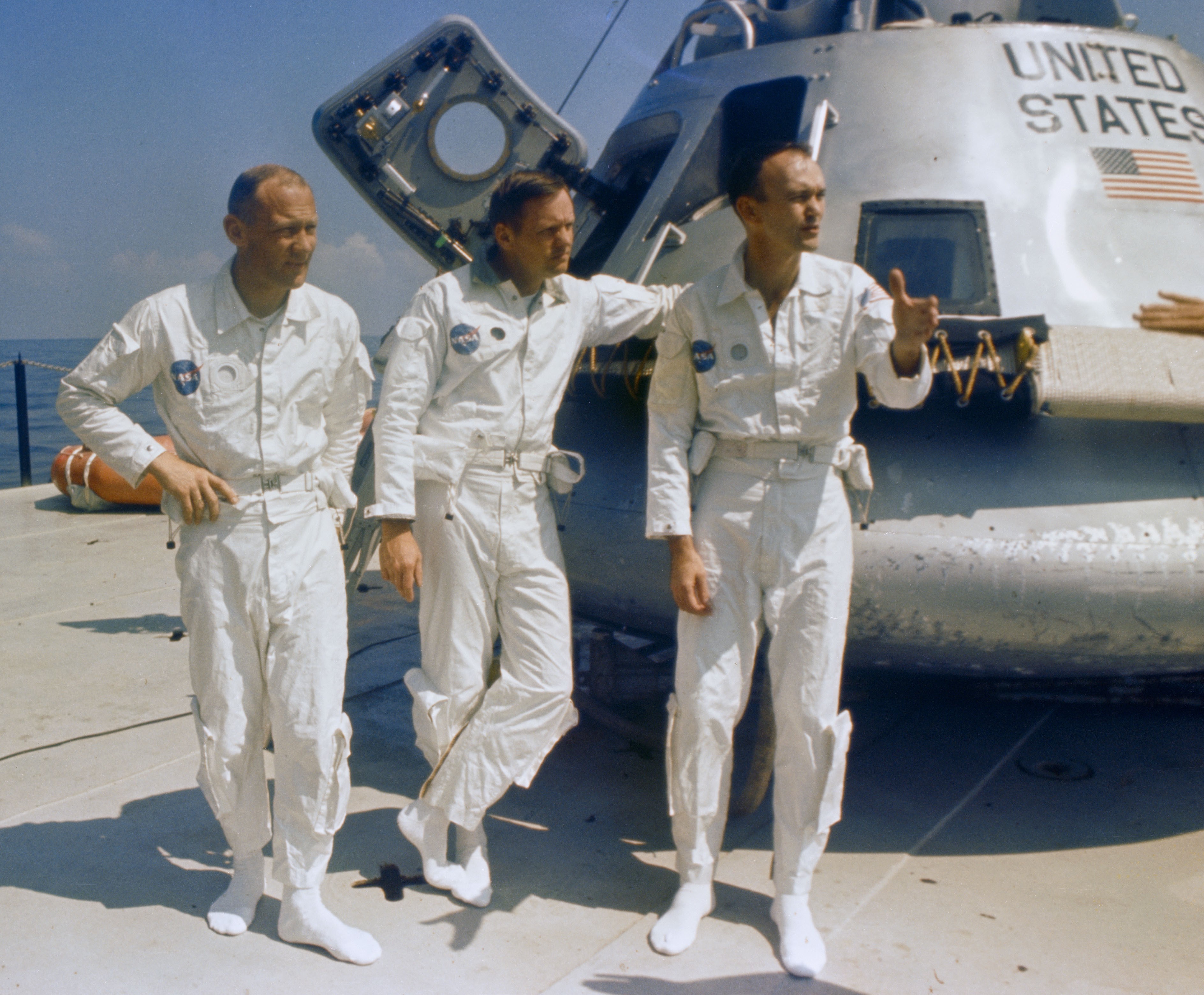 Apollo 11 astronauts Edwin E. “Buzz” Aldrin, left, Neil A. Armstrong, and Michael Collins aboard the MV Retriever prepare for the water egress test using the Biological Isolation Garment (BIG)