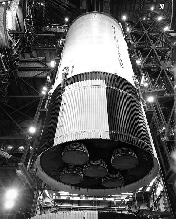 Workers lower the second stage onto the first stage