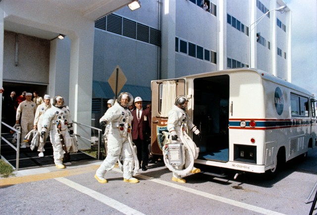 Young, front, Stafford, and Cernan prepare to board the van for the ride to Launch Pad 39B