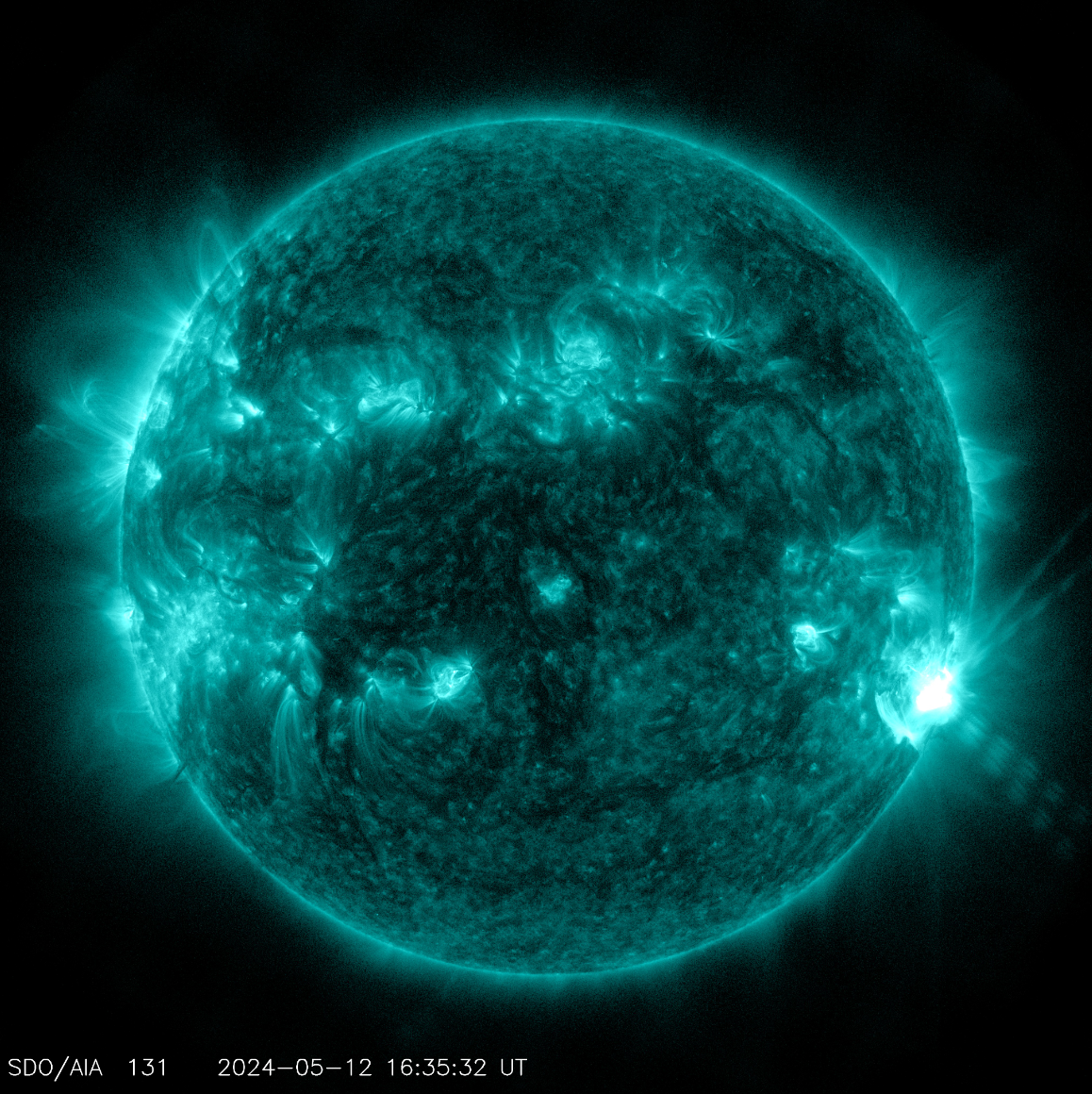 NASA’s Solar Dynamics Observatory captured this image of a solar flare – as seen in the bright flash in the lower right – on May 12. The image shows a subset of extreme ultraviolet light that highlights the extremely hot material in flares and which is colorized in teal.
