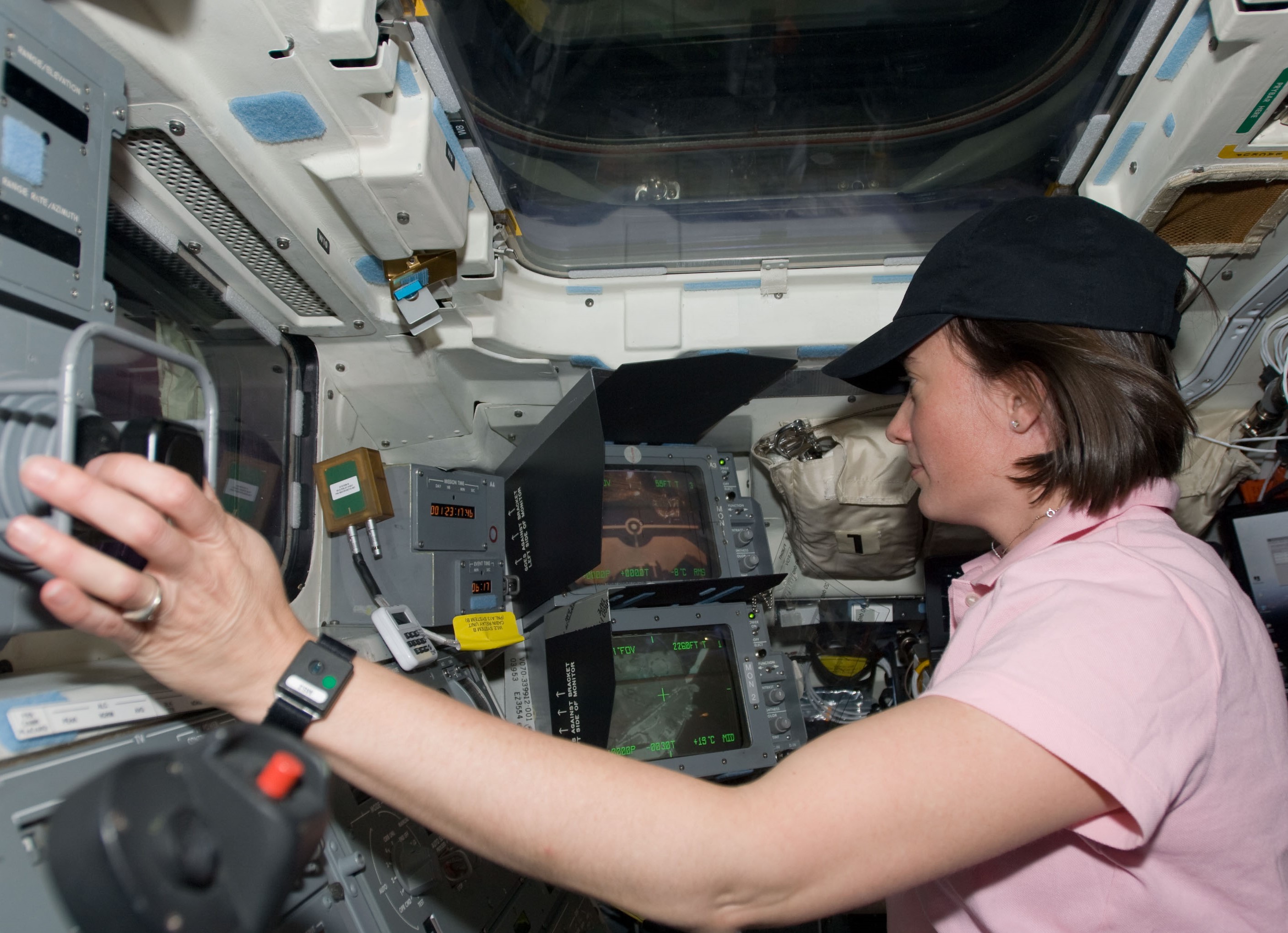 STS-125 astronaut K. Megan McArthur at the controls of the Remote Manipulator System (RMS), preparing to grapple Hubble