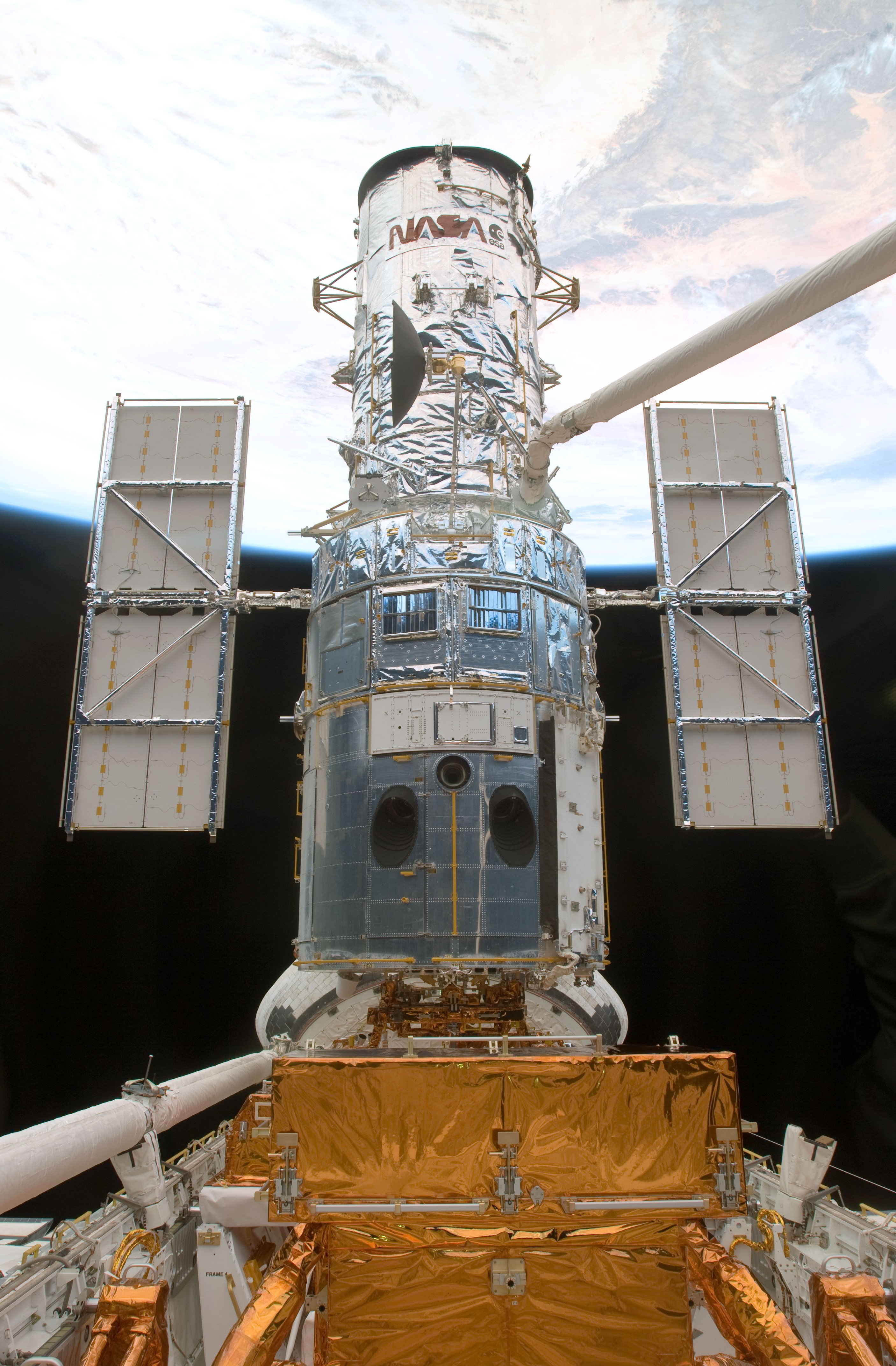 Astronaut K. Megan McArthur grapples the Hubble Space Telescope