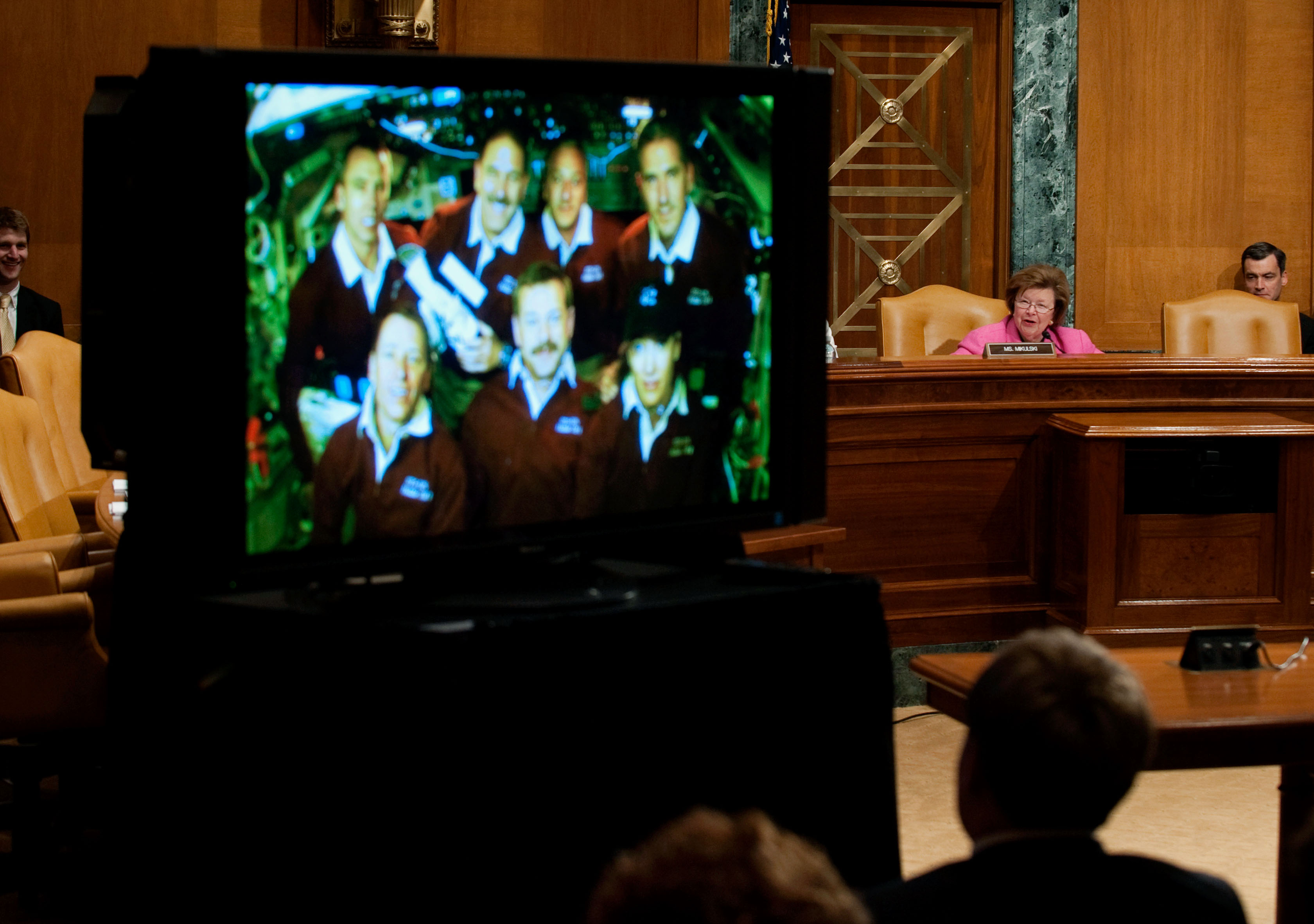 The STS-125 crew provides testimony via television to a Congressional committee