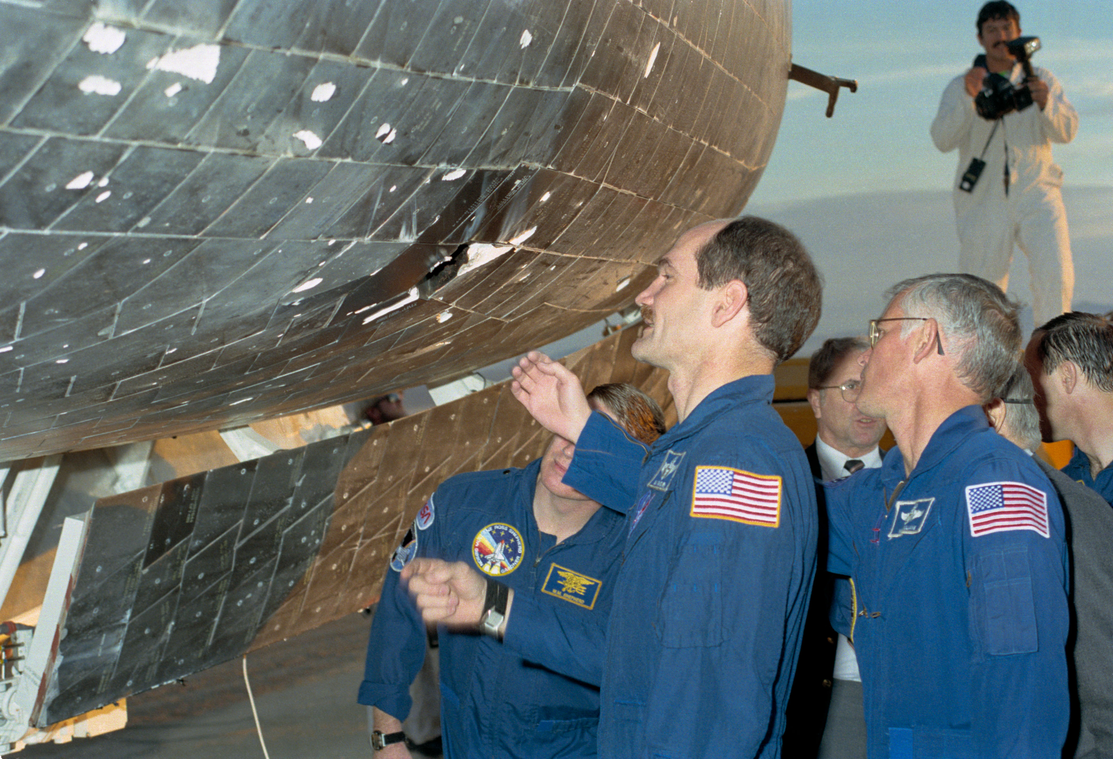 STS-27 astronauts inspect the tile damage on Atlantis