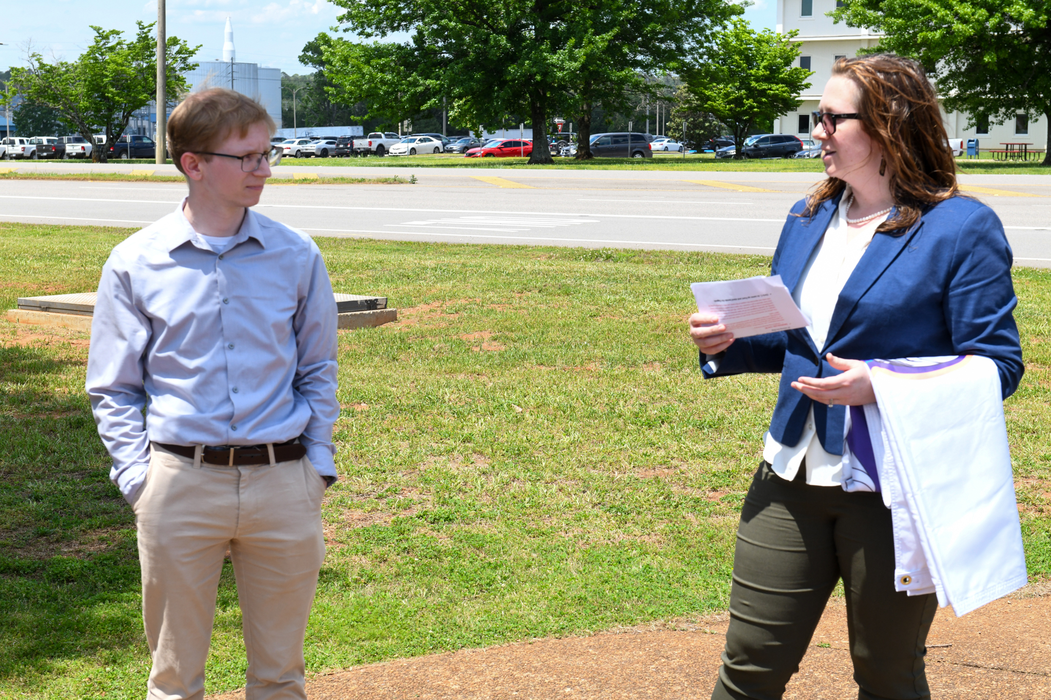 Chris Chiesa, left, listens as Lisa McCollum, deputy manager of the Exploration & Transportation Development Office, talks about Chiesa’s recognition as part of the Commercial Crew Program at NASA’s Marshall Space Flight Center during the Starliner flag-raising ceremony May 2.