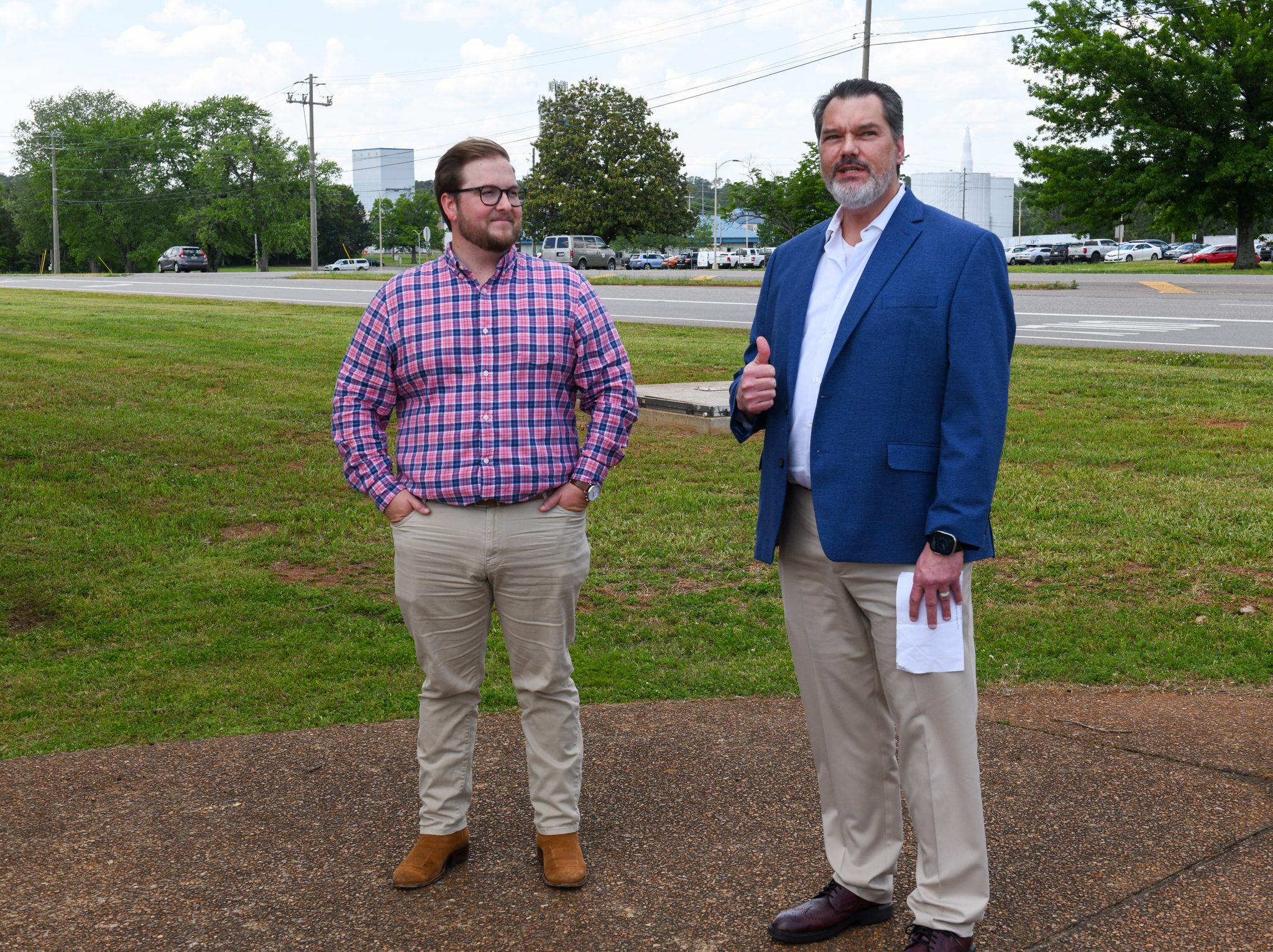 Brandyn Rolling, left, of the Payload Missions Operation Division at Marshall, listens as George Norris, deputy manager of the Payload & Mission Operations Division, talks about Rolling’s recognition during the Starliner flag-raising ceremony outside the Huntsville Operations Support Center on May 2.