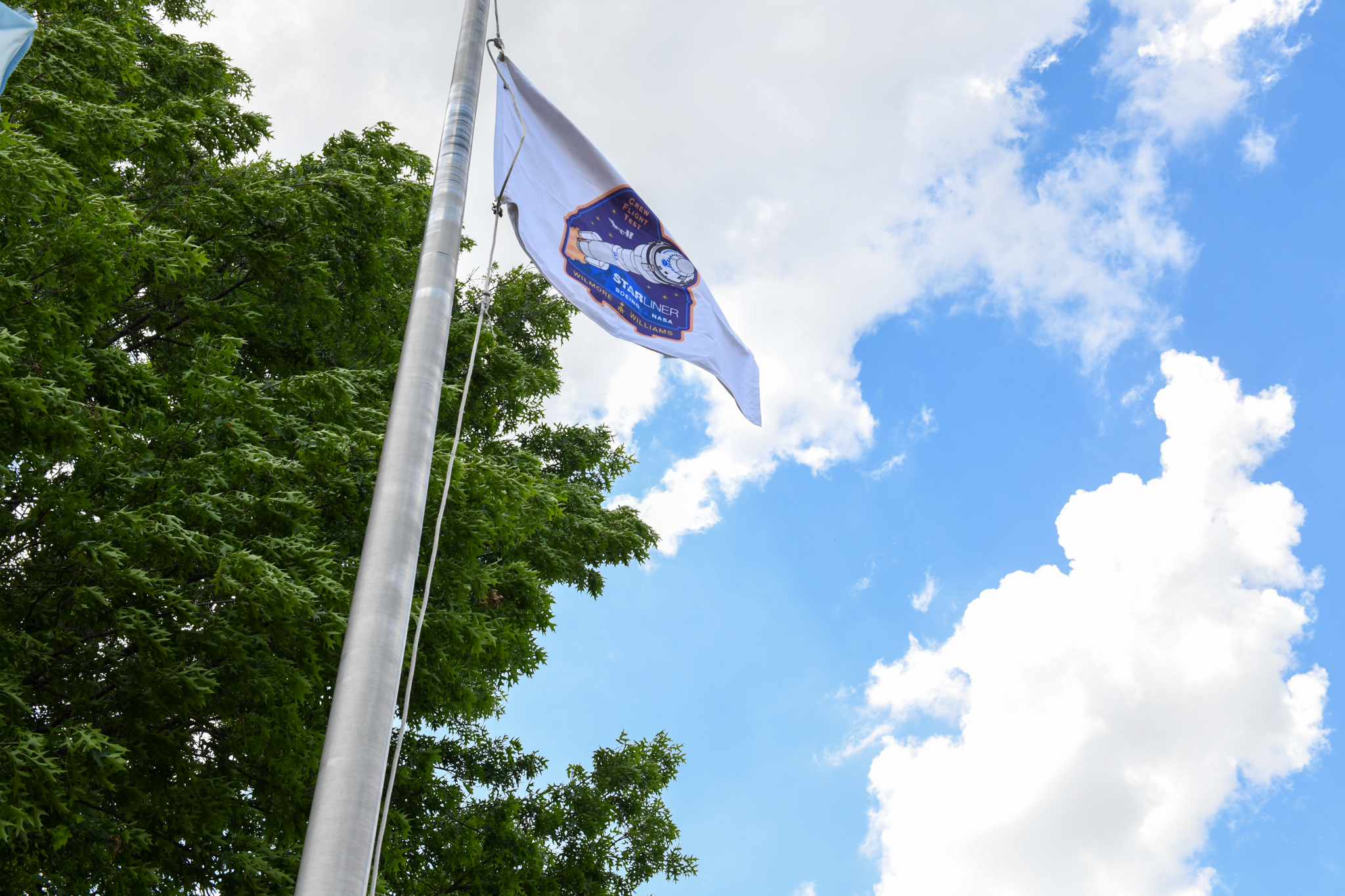 The Starliner flag flies outside the Huntsville Operations Support Center.