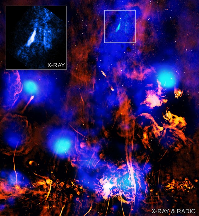 This image shows a region near the center of our Milky Way galaxy in X-ray and radio light. At the bottom of the image, near the center, is a brilliant, tangled knot of material that resembles a paint splatter. This is the brightest region in the image, and it contains the supermassive black hole at center of our galaxy, known as Sagittarius A*. Rising up from Sagittarius A* in the center of the image is a pillar of blue light referred to as a chimney. This chimney of hot gas is surrounded by red clouds that are filled with stars, presenting themselves as tiny red flecks. Near the top of the blue pillar is a streak of light blue, outlined by an illustrated, gray box. This streak is referred to as the chimney exhaust vent. Just to our left is another illustrated box that shows the close-up image of the chimney vent as observed by Chandra.